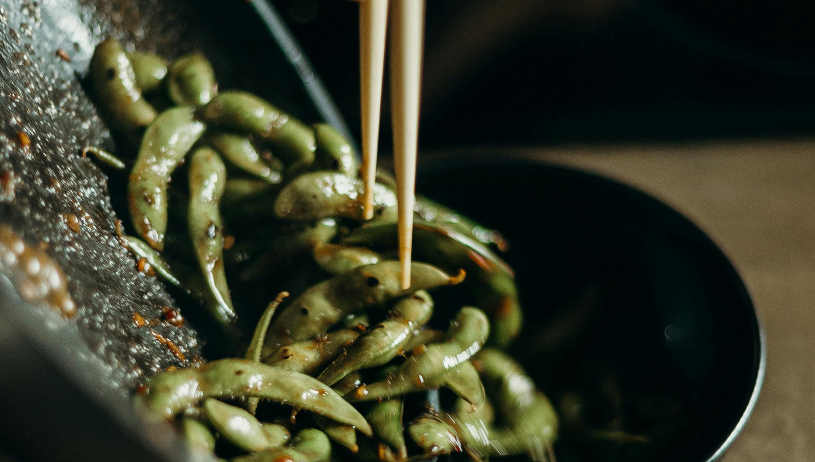 Gindo's sweet & spicy edamame beans with miso wasabi hot sauce.