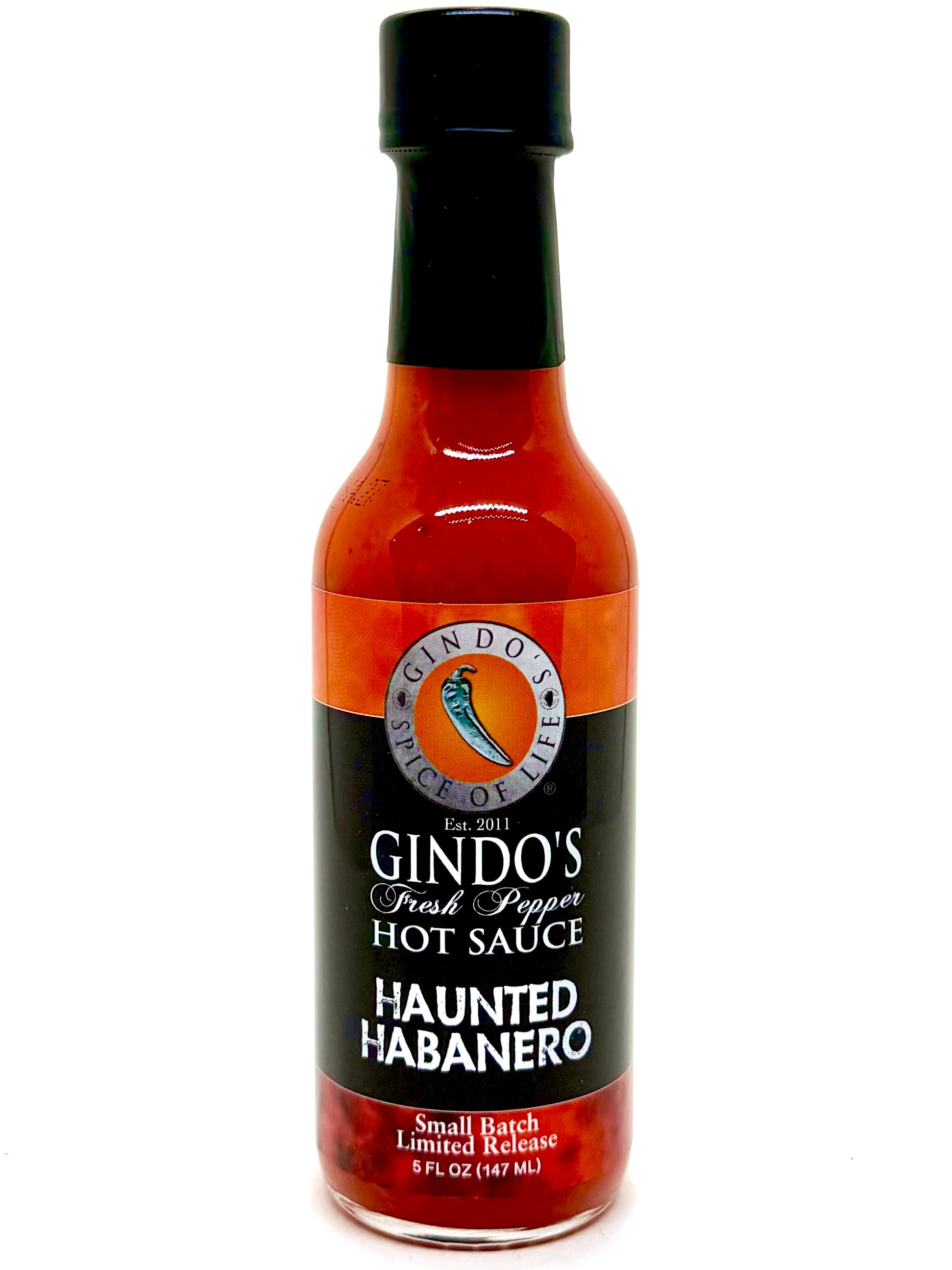 Bottle of Gindo's Haunted Habanero hot sauce on a white background