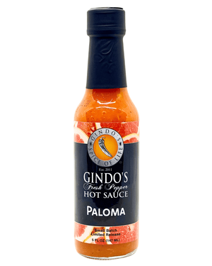 A 5 fl oz bottle of Gindo's Fresh Pepper Hot Sauce in the Paloma variety, featuring a black cap and a black label with red and orange accents, set against a plain white background.