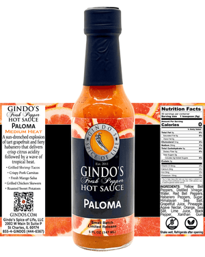 A bottle of Gindo's Fresh Pepper Hot Sauce 'Paloma' in the Medium Heat category, featuring a black cap, a black label with orange and yellow graphics, and a clear glass body showing the orange-red sauce inside. The background is white with product details and a QR code printed on the left.