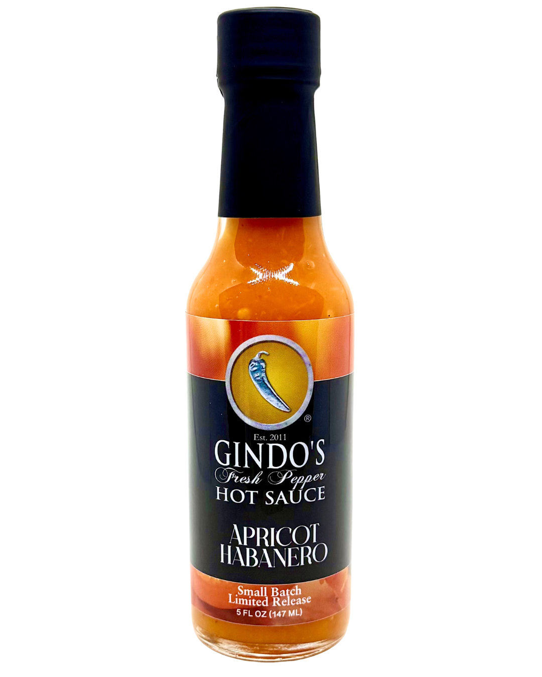 Bottle of Gindo's Apricot Habanero hot sauce on a white background